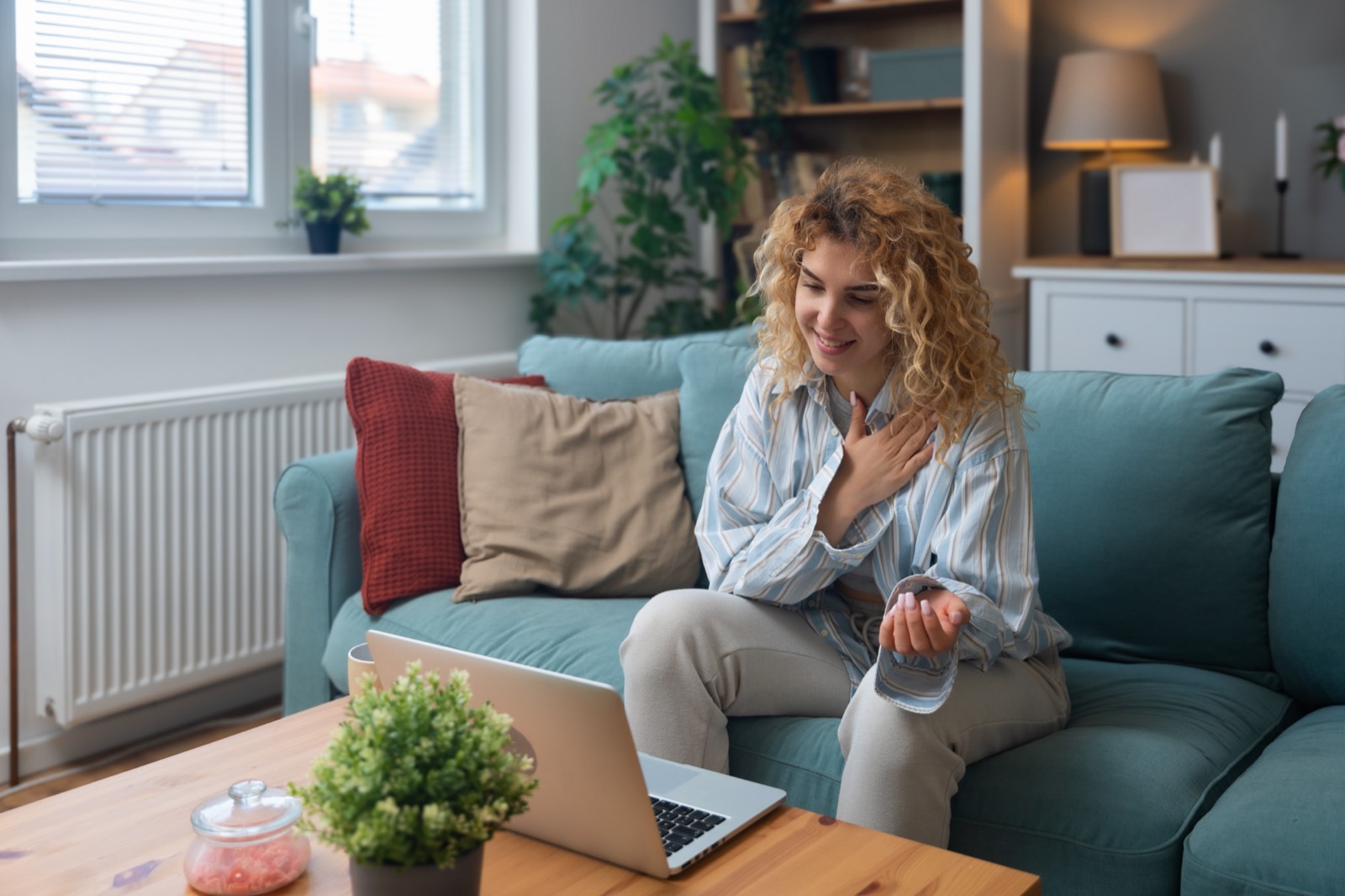 Woman on a video call with an orthopaedic specialist for an online rotator cuff consultation