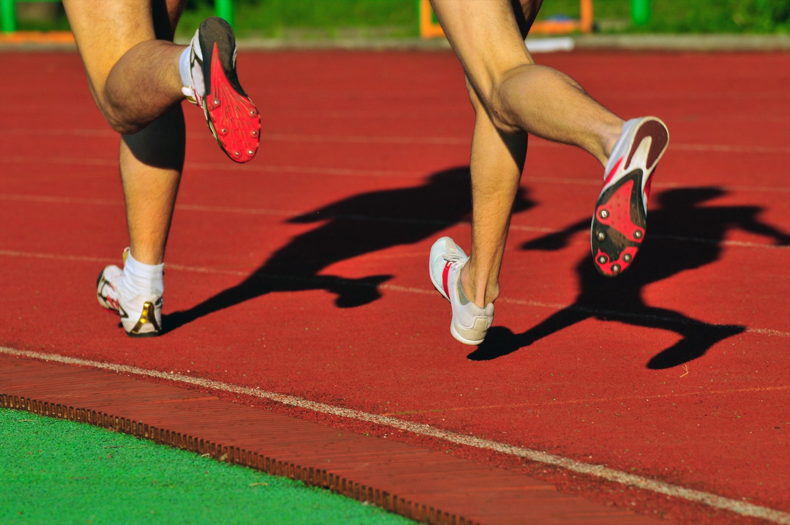 Runners on a track — a stress fracture specialist helps active people get back to sport safely